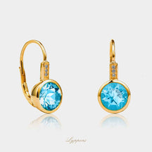 Geelgoud met topaas en diamant